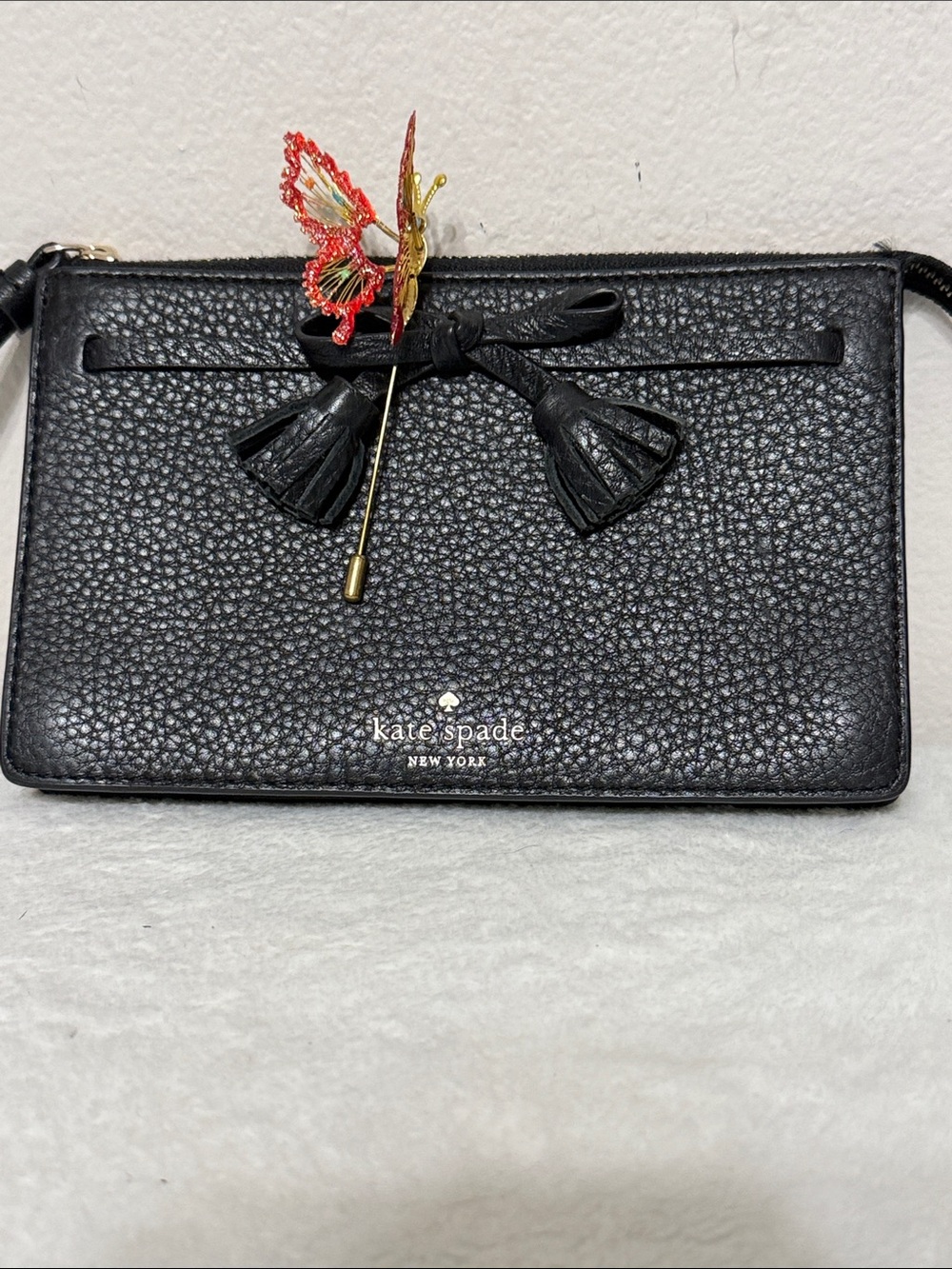 kate spade Black Pebbled Leather Wristlet Clutch with Tassel Bow